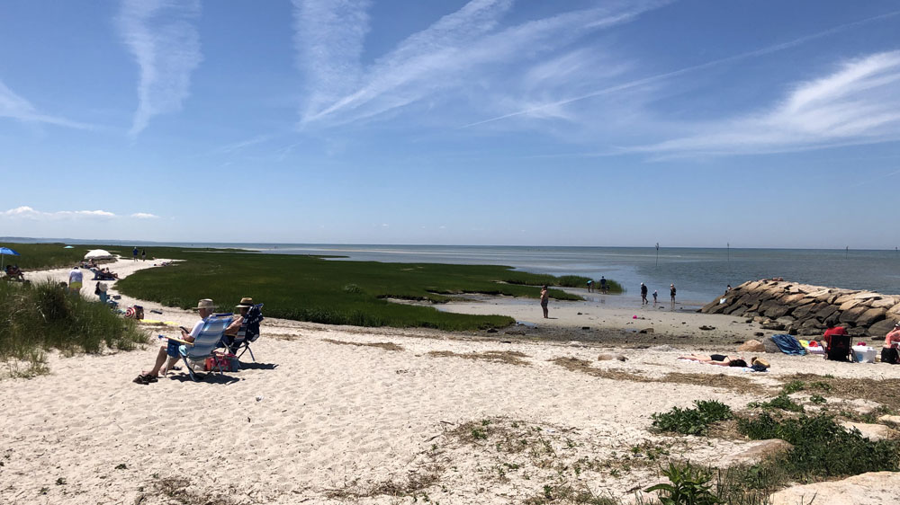 Beachgoers relax at Rock Harbor in Orleans, Cape Cod.