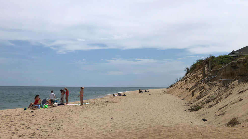 People relax by the dunes of Ballston Beach in Truro, Cape Cod.