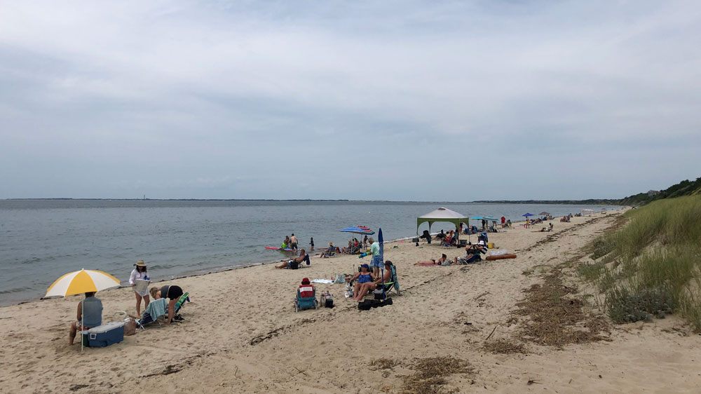 Crowds relax along the shore at Corn Hill Beach in Truro, Cape Cod.