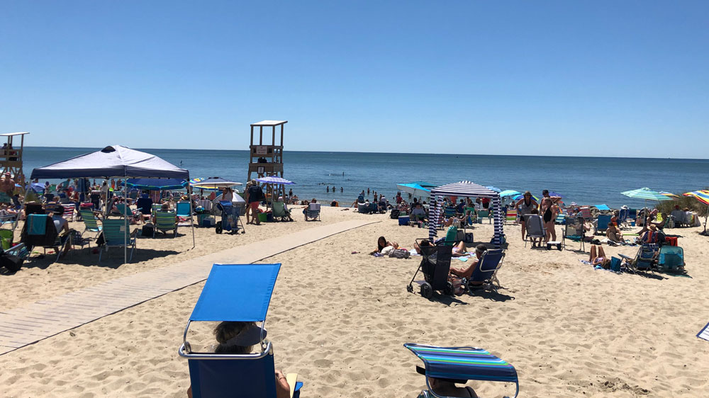 A boardwalk splits the beach at Earl Road Beach in Harwich, Cape Cod.