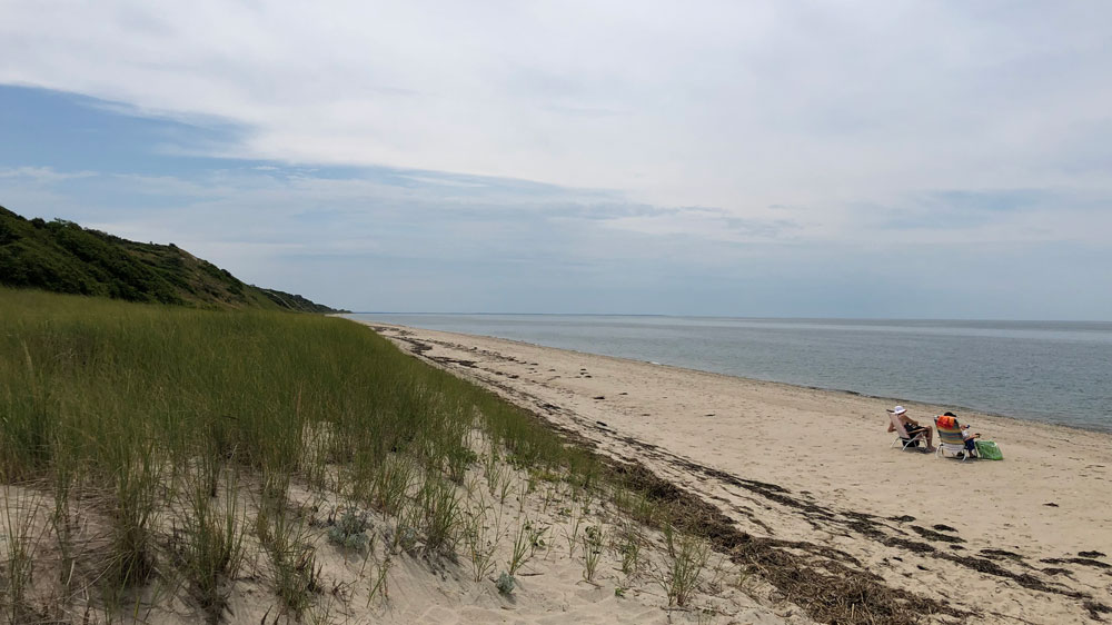 A couple relaxes at Fisher Beach in Truro, Cape Cod.