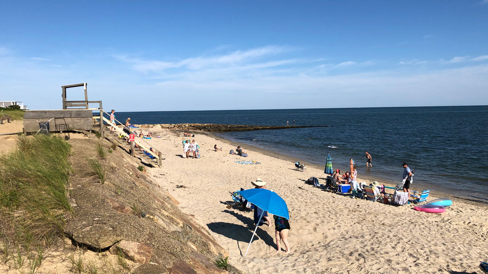 Crowds enjoy a sunny afternoon at Haigis Beach in Dennis, Cape Cod.