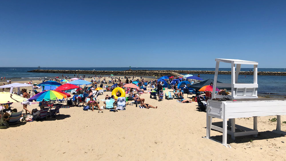 People relax on the shore of Harborview Beach in Dennis, Cape Cod.