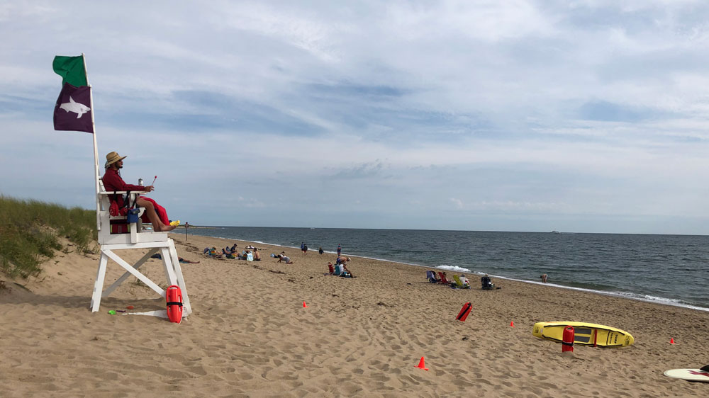 Lifeguards keep an eye on the water at Herring Cove Beach in Provincetown, Cape Cod.