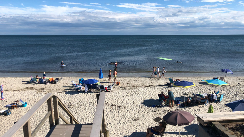 People relax on a sunny afternoon at Ocean Avenue Beach in Harwich, Cape Cod.