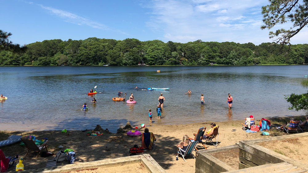 Kids swim in the water at Sand Pond in Harwich, Cape Cod.