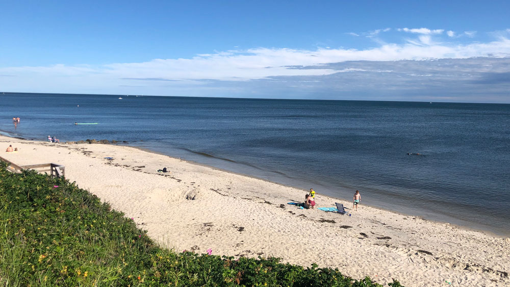 Children play on a summer afternoon at Sea Breeze Avenue Beach in Harwich, Cape Cod.