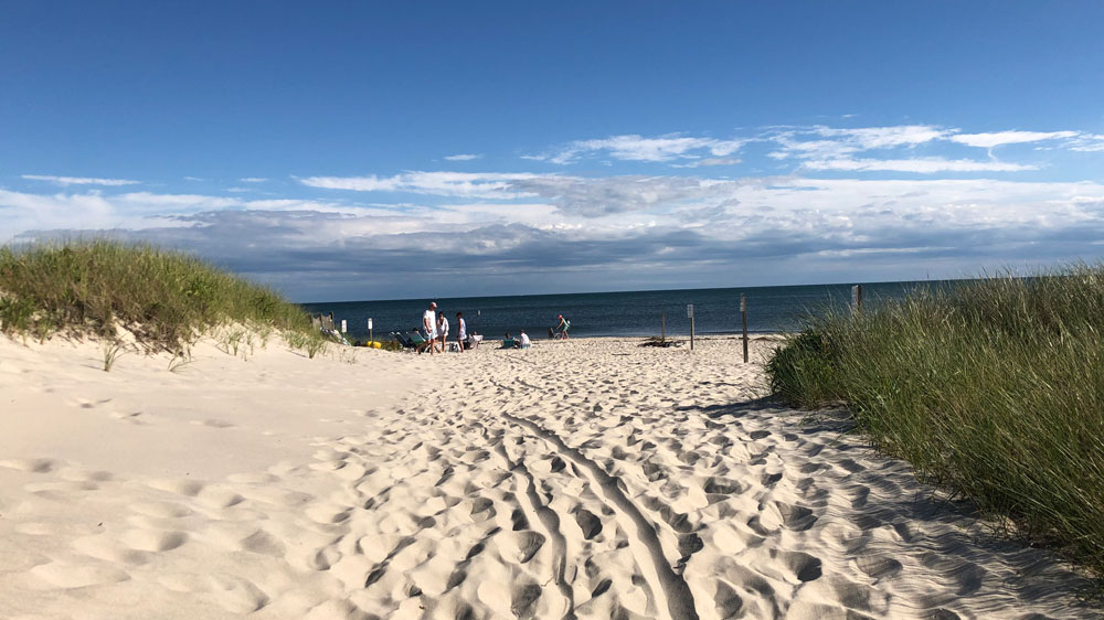 A sunny summer afternoon at Sea Street Beach in Harwich, Cape Cod.