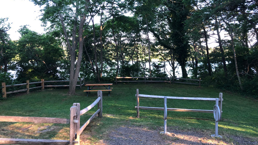 A picnic area overlooks White Pond in Chatham, Cape Cod.