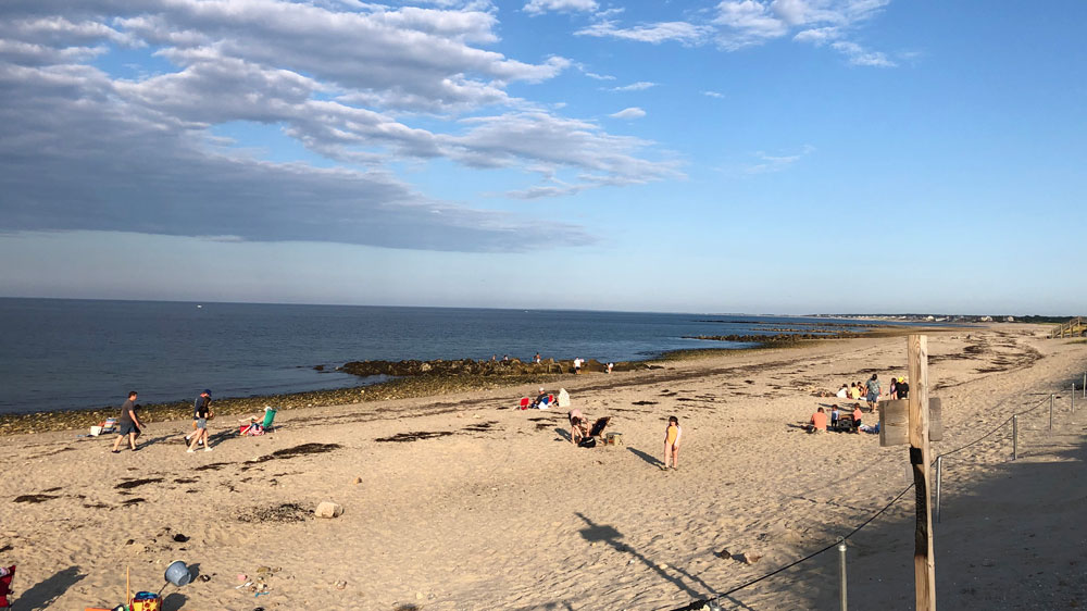 Beachgoers enjoy a summer afternoon at Town Neck Beach in Sandwich, Cape Cod.