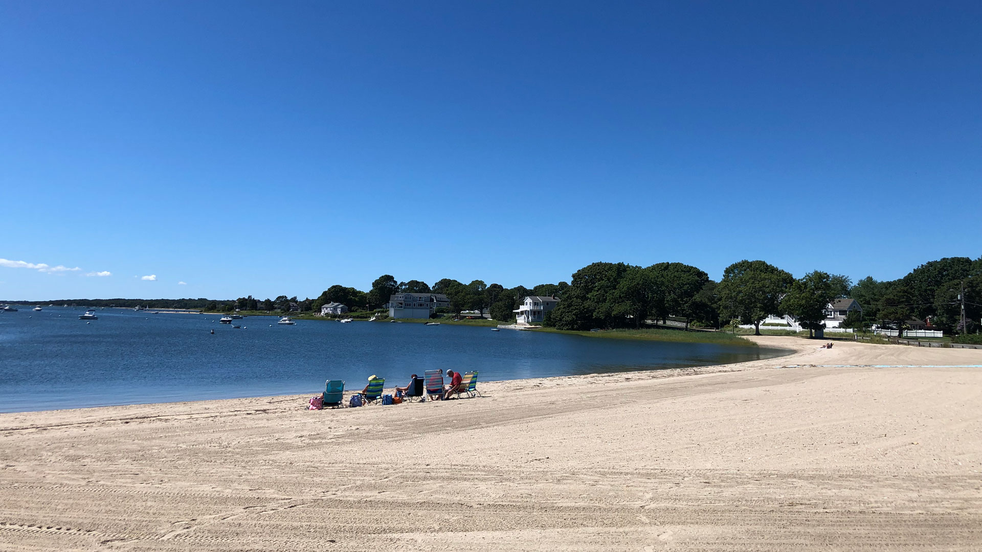 Beachgoers relax at one of the Bourne Beaches on Cape Cod.