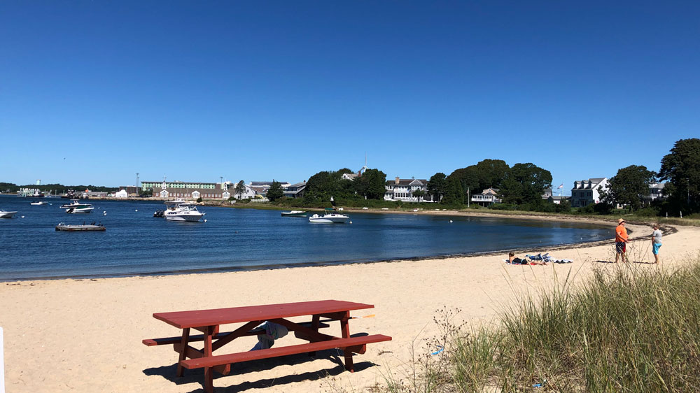 Boats sit just offshore at Gray Gables Beach in Bourne, Cape Cod.