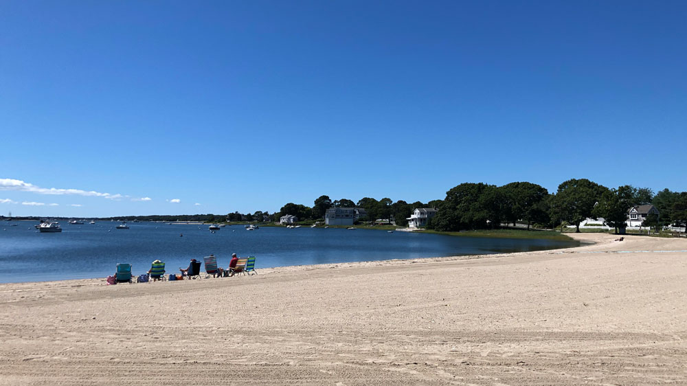 A group enjoys a summer morning at Hen Cove in Bourne, Cape Cod.