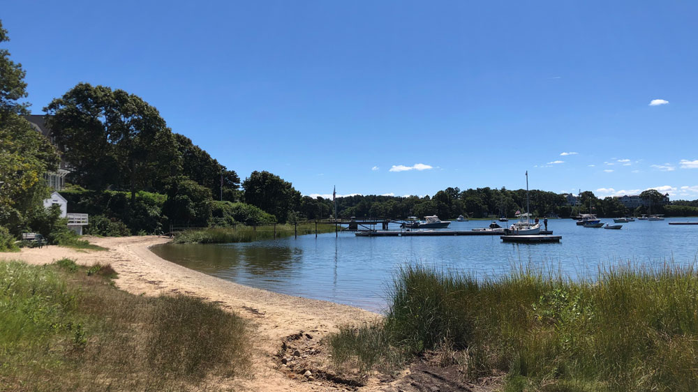 A seagrass lined path leads to Squeteague in Bourne, Cape Cod.